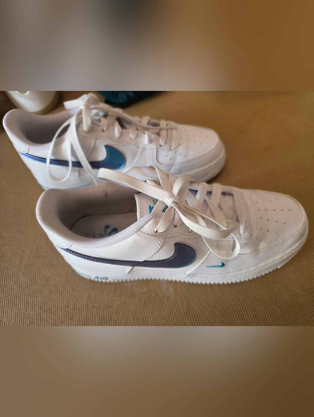 Nike Kids White Sneakers with Blue Swoosh Accents